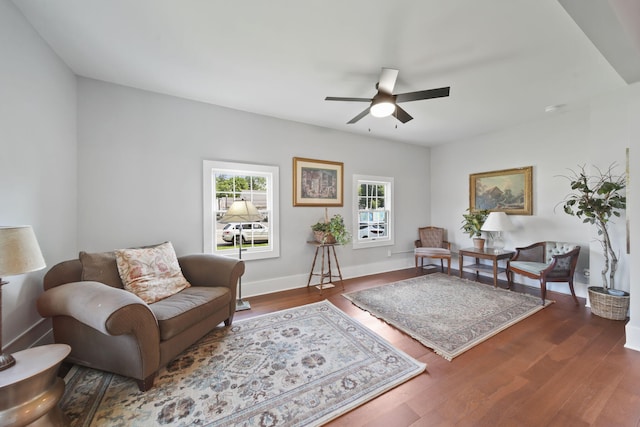 911 E Ganson St, Jackson, MI 49201 - living area with ceiling fan, wood finished floors, and baseboards