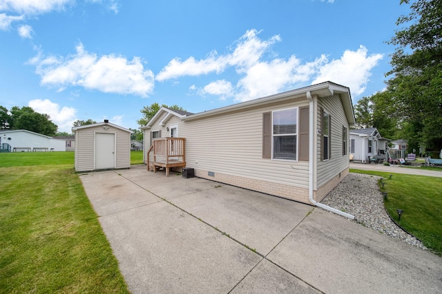 948 Savannah River Dr, Adrian, MI 49221 - view of side of property featuring a lawn and crawl space