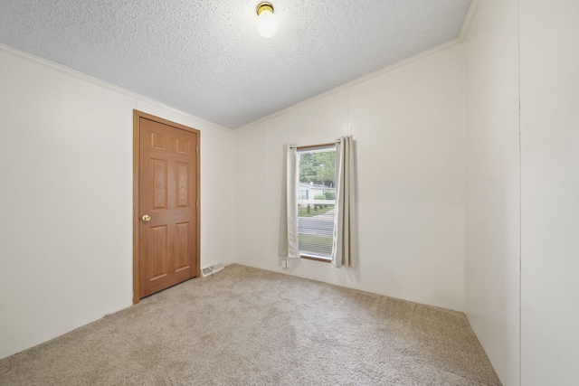948 Savannah River Dr, Adrian, MI 49221 - spare room featuring light carpet, vaulted ceiling, a textured ceiling, and crown molding