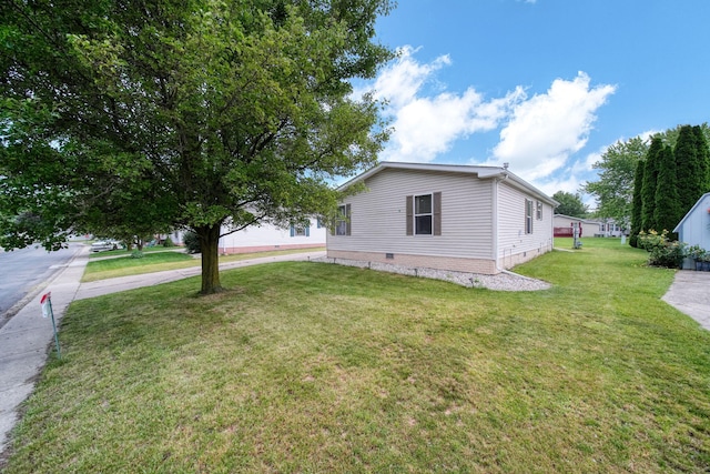 948 Savannah River Dr, Adrian, MI 49221 - view of side of property with a yard and crawl space
