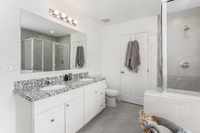 9403 Nature View Ln, Ypsilanti, MI 48197 - full bathroom with a stall shower, double vanity, tile patterned floors, and toilet
