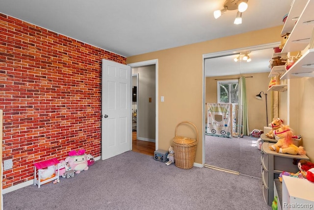 5445 Frankwill Ave, Clarkston, MI 48346 - rec room featuring brick wall and carpet