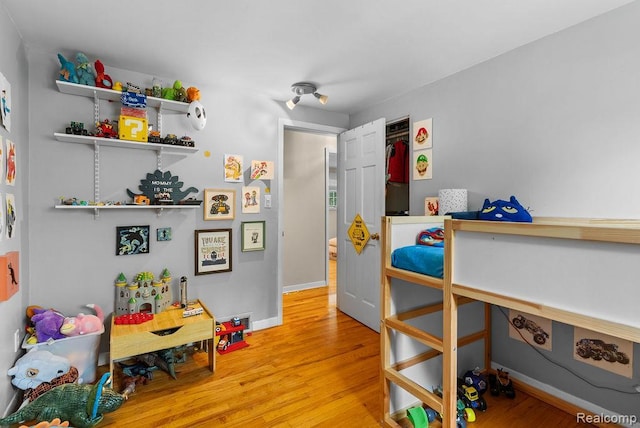 5445 Frankwill Ave, Clarkston, MI 48346 - bedroom with light wood-type flooring and baseboards