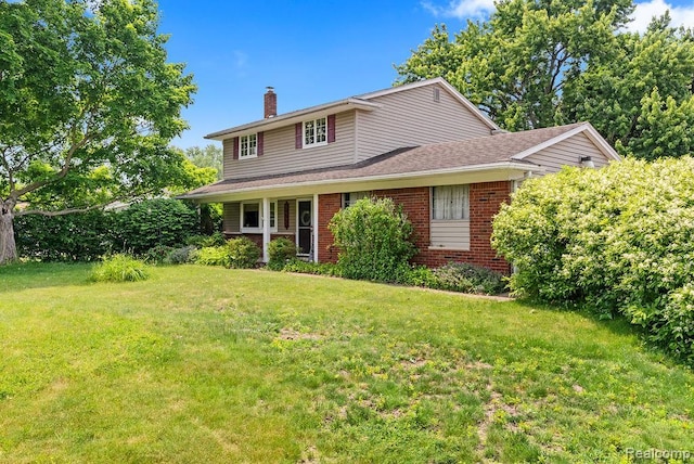 5445 Frankwill Ave, Clarkston, MI 48346 - traditional home with a chimney, brick siding, a front lawn, and roof with shingles