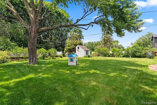 5445 Frankwill Ave, Clarkston, MI 48346 - view of green lawn featuring a storage unit