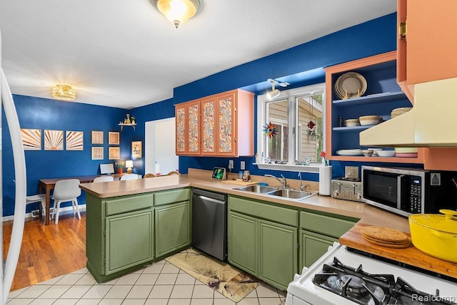 5445 Frankwill Ave, Clarkston, MI 48346 - kitchen featuring green cabinets, dishwashing machine, stainless steel microwave, a peninsula, and light countertops