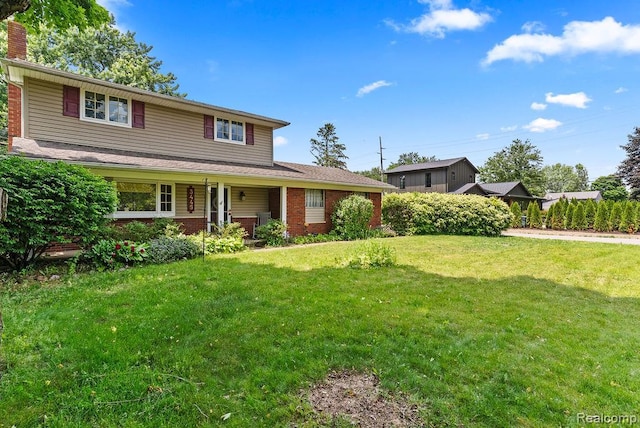 5445 Frankwill Ave, Clarkston, MI 48346 - traditional-style home featuring a chimney, a porch, brick siding, and a front lawn
