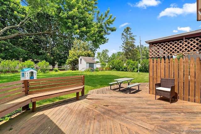 5445 Frankwill Ave, Clarkston, MI 48346 - wooden terrace featuring a storage shed, a lawn, and view of scattered trees