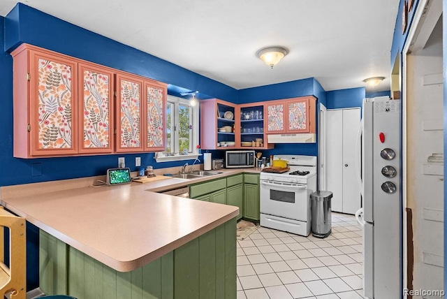 5445 Frankwill Ave, Clarkston, MI 48346 - kitchen featuring stainless steel appliances, green cabinets, under cabinet range hood, a peninsula, and light countertops