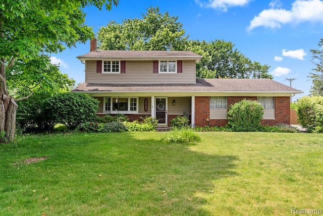 5445 Frankwill Ave, Clarkston, MI 48346 - traditional-style house with a chimney, brick siding, a front lawn, and a porch