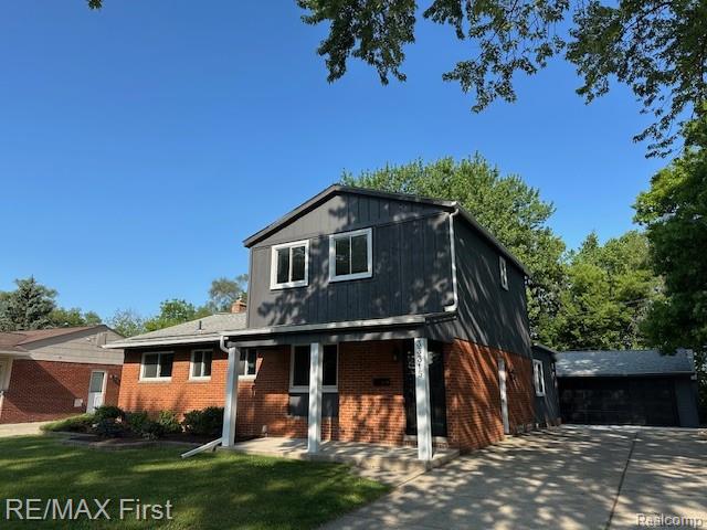 33315 Vista Way, Fraser, MI 48026 - view of front of home with brick siding and a front lawn