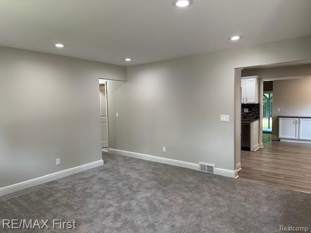 33315 Vista Way, Fraser, MI 48026 - spare room with recessed lighting, dark colored carpet, and baseboards