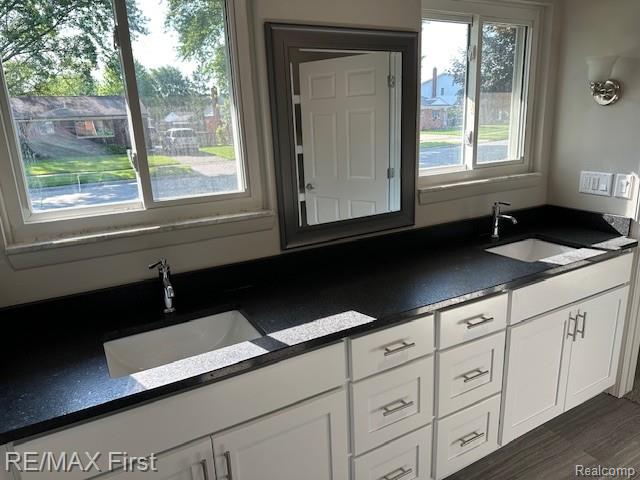 33315 Vista Way, Fraser, MI 48026 - kitchen featuring a sink, dark countertops, and white cabinets