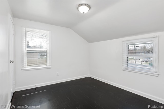 22005 Rausch Ave, Eastpointe, MI 48021 - bonus room featuring lofted ceiling, baseboards, and dark wood finished floors