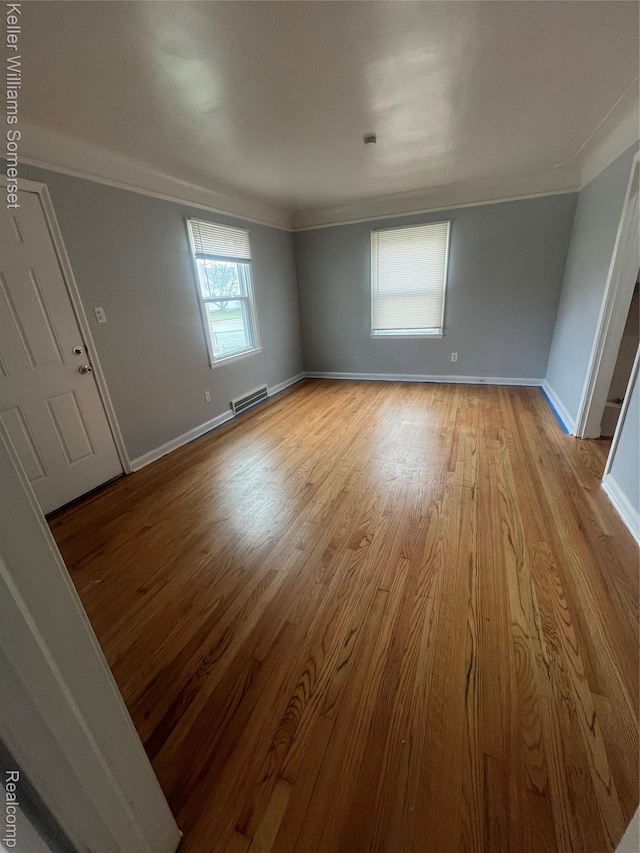 22005 Rausch Ave, Eastpointe, MI 48021 - spare room featuring ornamental molding, light wood-style floors, and baseboards
