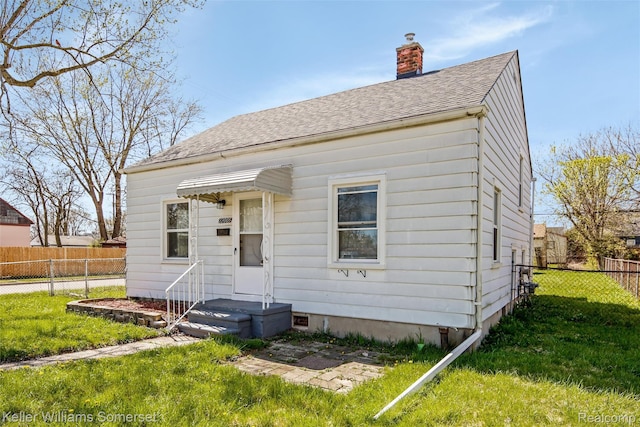 22005 Rausch Ave, Eastpointe, MI 48021 - back of house with a chimney and roof with shingles
