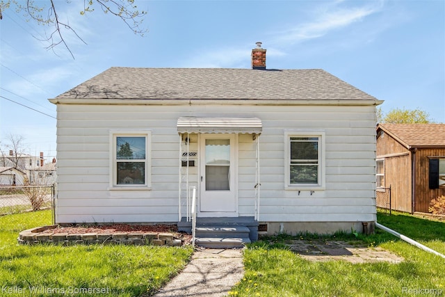 22005 Rausch Ave, Eastpointe, MI 48021 - bungalow-style house with a chimney and roof with shingles