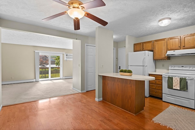 515 Georgetown Dr, Traverse City, MI 49684 - kitchen featuring white appliances, extractor fan, baseboard heating, light countertops, and brown cabinets