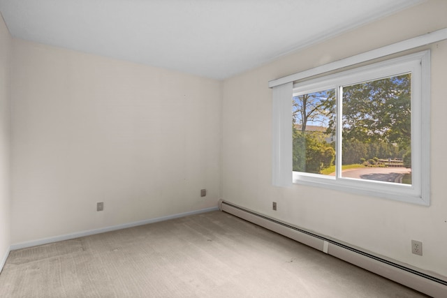 515 Georgetown Dr, Traverse City, MI 49684 - unfurnished room featuring a baseboard heating unit, light colored carpet, and baseboards