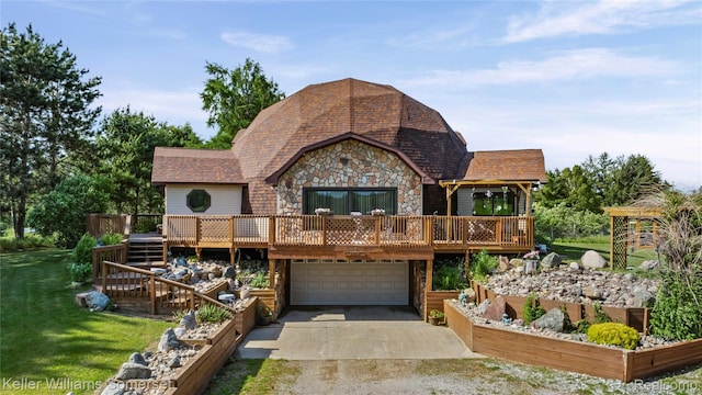 2637 E 7th Rd, Roscommon, MI 48653 - view of front of home with stone siding, a deck, an attached garage, and a front lawn
