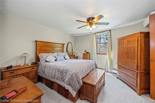2637 E 7th Rd, Roscommon, MI 48653 - bedroom featuring light carpet, a baseboard heating unit, and a ceiling fan