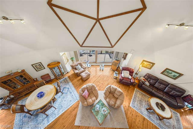 2637 E 7th Rd, Roscommon, MI 48653 - living room with high vaulted ceiling and wood finished floors