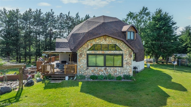 2637 E 7th Rd, Roscommon, MI 48653 - view of front of property featuring stone siding, a front yard, and roof with shingles