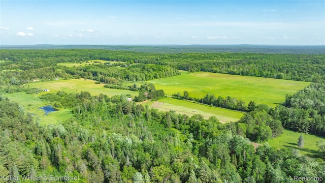 2637 E 7th Rd, Roscommon, MI 48653 - aerial overview of property's location with a heavily wooded area