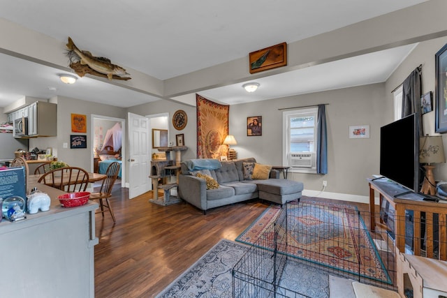 1026 Jennings Ave, Benton Harbor, MI 49022 - living area with dark wood-style floors, baseboards, and cooling unit