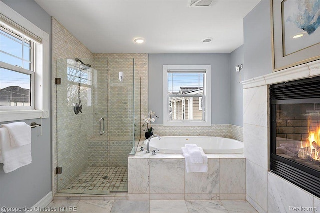 1419 Henrietta St, Birmingham, MI 48009 - full bath with a glass covered fireplace, a garden tub, a stall shower, marble finish flooring, and recessed lighting
