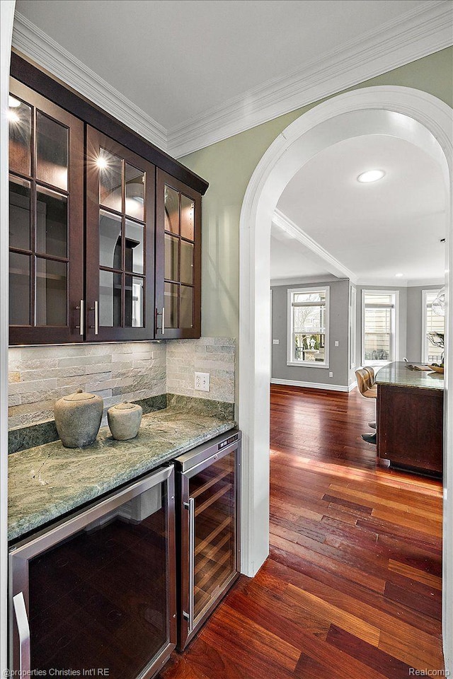 1419 Henrietta St, Birmingham, MI 48009 - bar with beverage cooler, arched walkways, dark wood-style floors, decorative backsplash, and crown molding