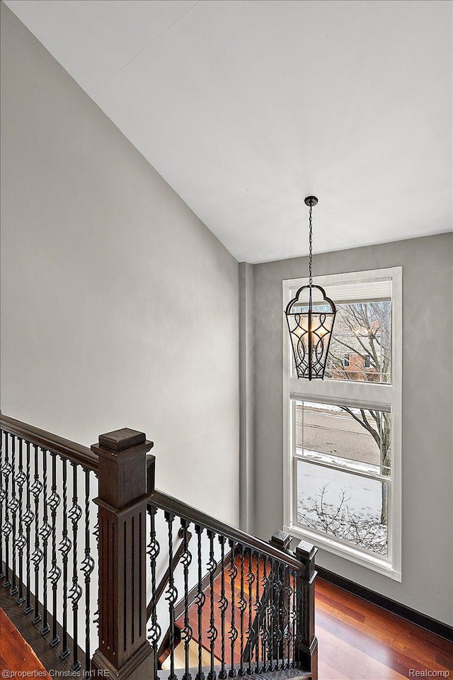 1419 Henrietta St, Birmingham, MI 48009 - staircase featuring a chandelier and wood finished floors