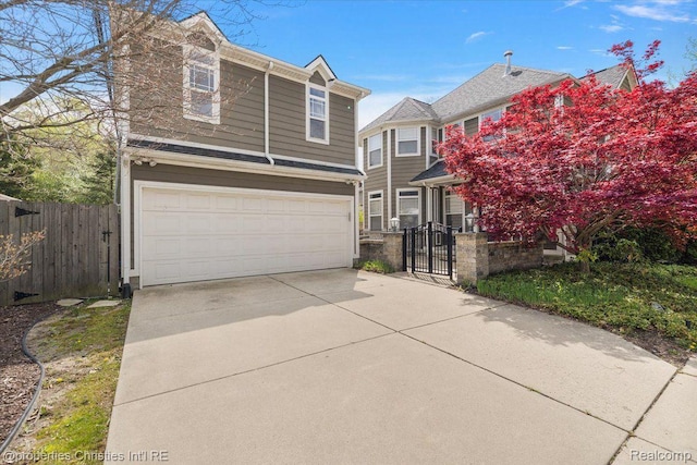 1419 Henrietta St, Birmingham, MI 48009 - traditional-style house with a garage, a gate, and concrete driveway