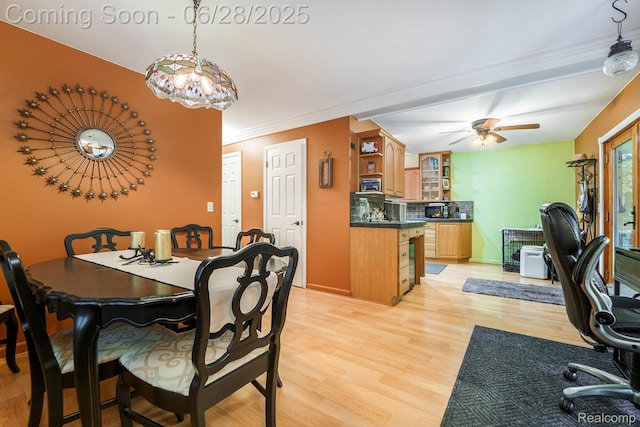 3030 Stanton Rd, Oxford, MI 48371 - dining space featuring light wood-style flooring, a ceiling fan, and an office area