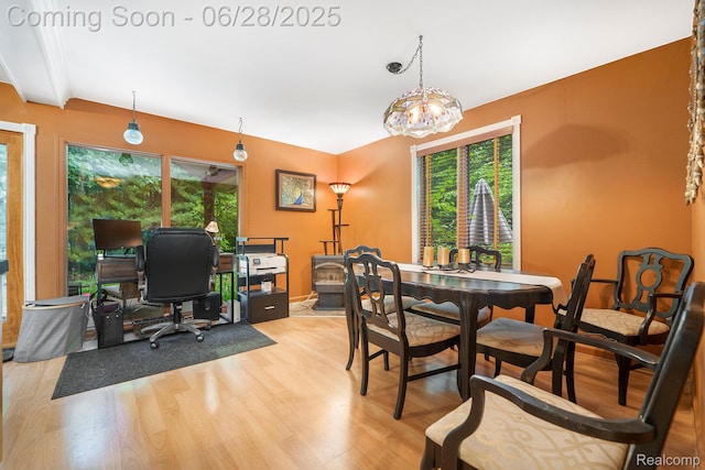 3030 Stanton Rd, Oxford, MI 48371 - dining area with healthy amount of natural light, wood finished floors, a desk, and a chandelier