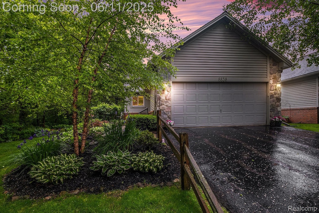 8838 Cedar Ln, Clarkston, MI 48348 - garage with driveway