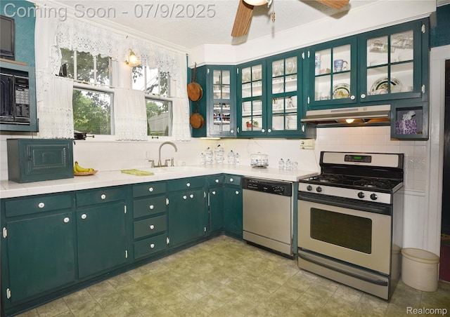 1719 Sycamore Ave, Royal Oak, MI 48073 - kitchen with appliances with stainless steel finishes, under cabinet range hood, decorative backsplash, a ceiling fan, and ornamental molding