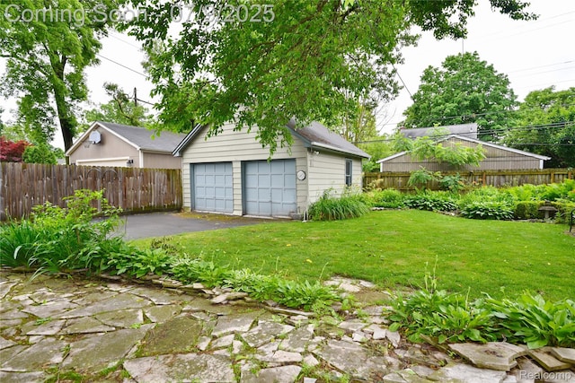 1719 Sycamore Ave, Royal Oak, MI 48073 - view of yard featuring a detached garage and an outbuilding