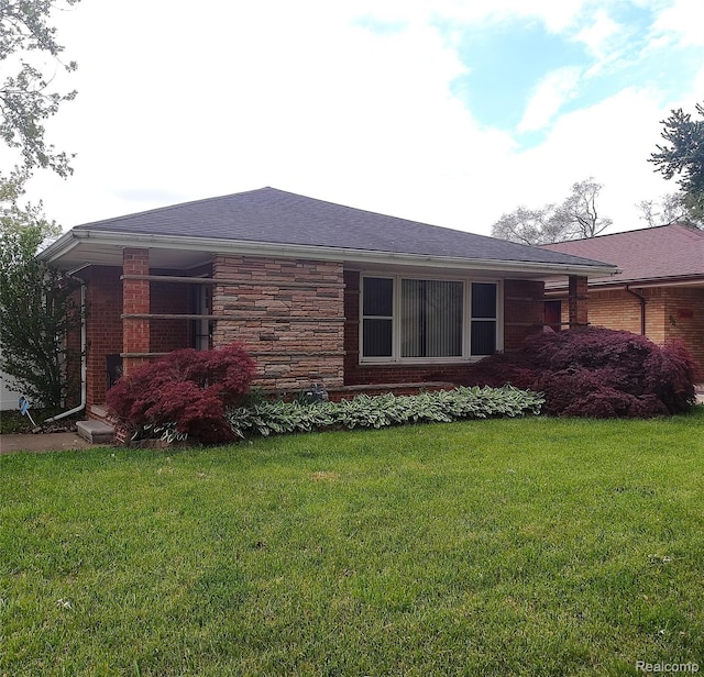 20456 Van Antwerp St W, Harper Woods, MI 48225 - view of property exterior featuring a lawn and brick siding