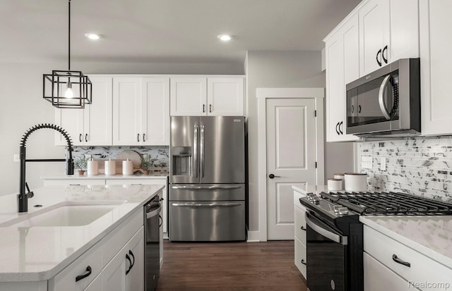 1778 Addison Cir, Walled Lake, MI 48390 - kitchen with stainless steel appliances, a sink, backsplash, white cabinetry, and dark wood finished floors