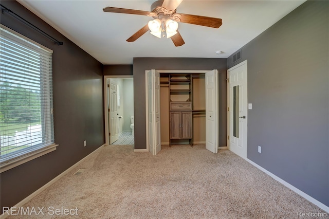 11468 Grand Oaks Dr, Clio, MI 48420 - unfurnished bedroom with light carpet, multiple windows, a closet, and ceiling fan