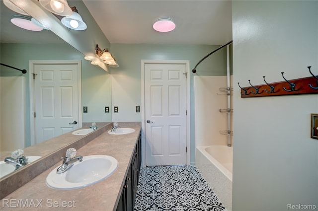 11468 Grand Oaks Dr, Clio, MI 48420 - bathroom featuring double vanity, tub / shower combination, and tile patterned flooring