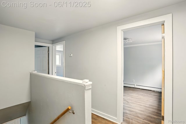 22521 Hoffman St, Saint Clair Shores, MI 48082 - corridor with an upstairs landing, a baseboard heating unit, wood finished floors, and baseboards