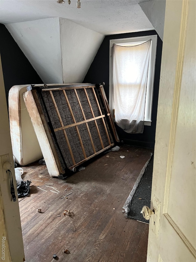 1039 Markham St, Flint, MI 48507 - bathroom featuring lofted ceiling and wood finished floors