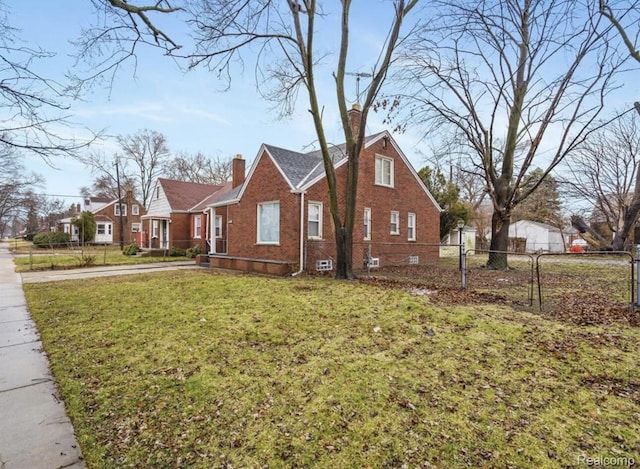 19611 Revere St, Detroit, MI 48234 - view of side of property with a chimney and brick siding