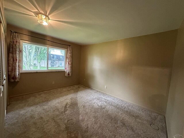 101 Provincial Ct, Saginaw, MI 48638 - spare room featuring carpet flooring and baseboards