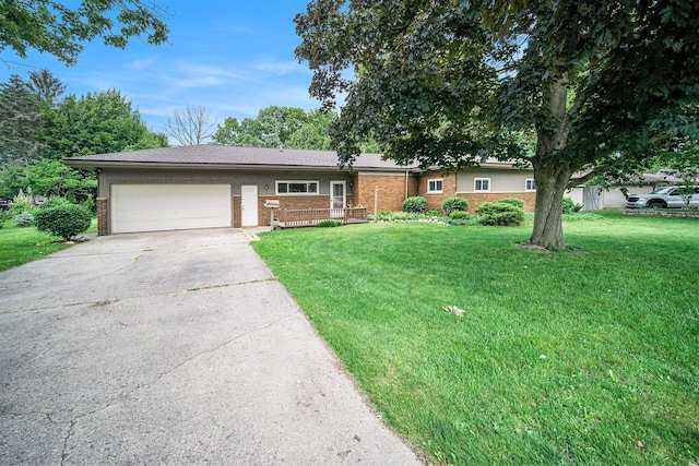 55 E Lewis Ave, Milan, MI 48160 - ranch-style home with driveway, a front yard, an attached garage, and brick siding