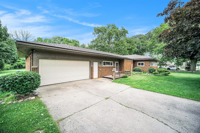 55 E Lewis Ave, Milan, MI 48160 - ranch-style house featuring brick siding, driveway, an attached garage, and a front yard