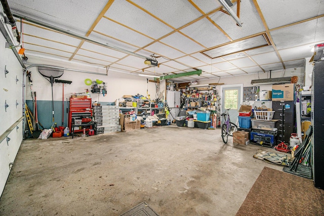 55 E Lewis Ave, Milan, MI 48160 - garage featuring a workshop area and a garage door opener