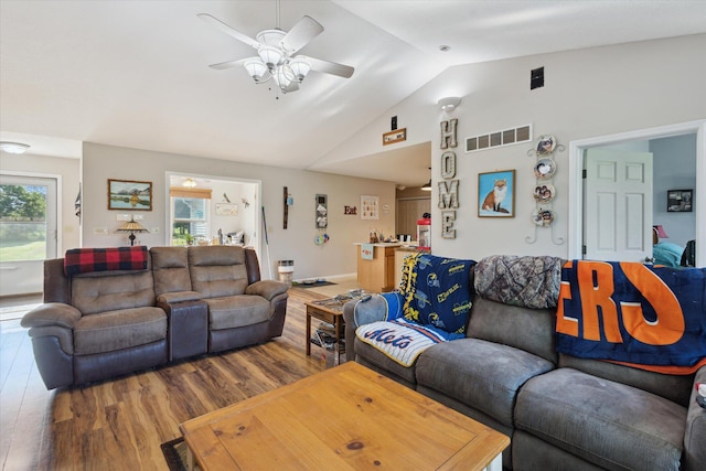 8078 S Royston Rd, Eaton Rapids, MI 48827 - living room featuring lofted ceiling, wood finished floors, plenty of natural light, and a ceiling fan